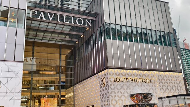 Kuala Lumpur,Malaysia - 31 July 2026: Exterior view of Pavilion entrance with Louis Vuitton luxury store facade and fountain.