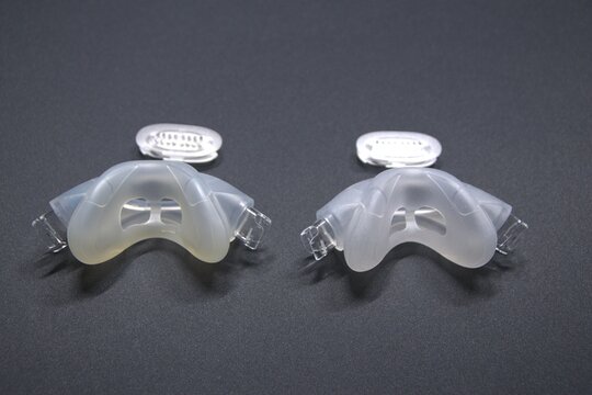 Old nasal CPAP mask or old nasal CPAP cradle cushion needs replacement for hygienic sleep apnea disorder therapy. Sleep apnea and sleep disorder with snoring stopped by respirator mask CPAP machine.
