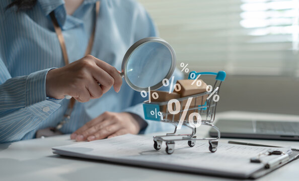 Consumer shopping concept with magnifying glass examining shopping cart, discount symbols, price comparison, online shopping, smart buying, retail promotion, ecommerce savings, and purchase decision.