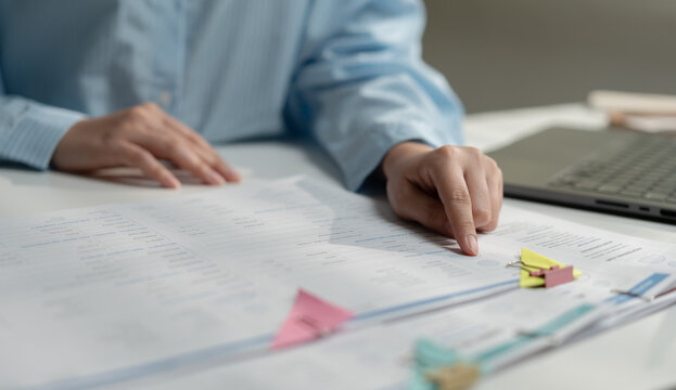 Businesswoman reviewing candidate profiles and performance ratings for recruitment, hiring, talent acquisition, employee assessment, HR management and workforce selection