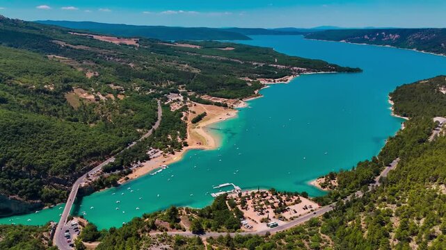Aerial drone view of the turquoise Verdon River flowing through the Verdon Gorge river canyon in the Provence-Alpes-Cote d'Azur region of southeastern France. High quality 4k footage