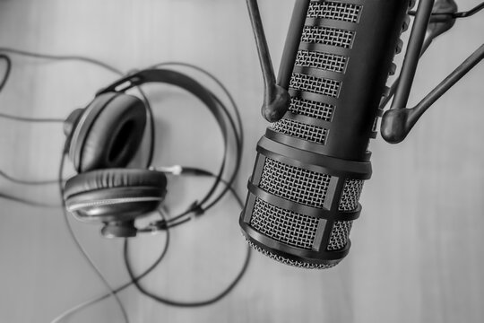 Professional  microphone with headphones on desk
