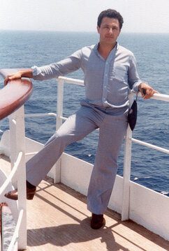 Man enjoying ocean cruise journey on boat deck