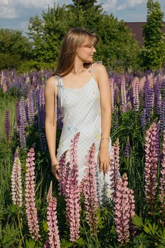 young woman enjoy summer in lupin meadow