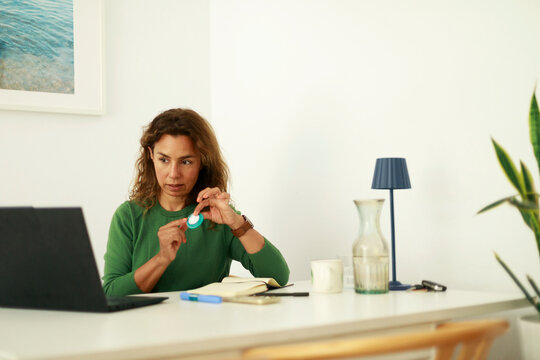 Woman showing hormones pills