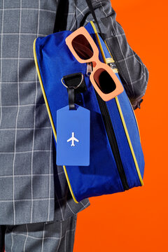a man carries a travel bag ready to depart