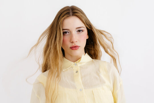 Woman with blonde hair looking at camera