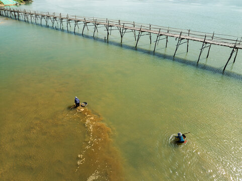 Ong Cop Wooden Bridge with Fishermen, Phu Yen, Vietnam