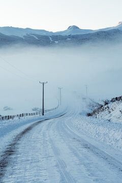 Icy Road Through Fog