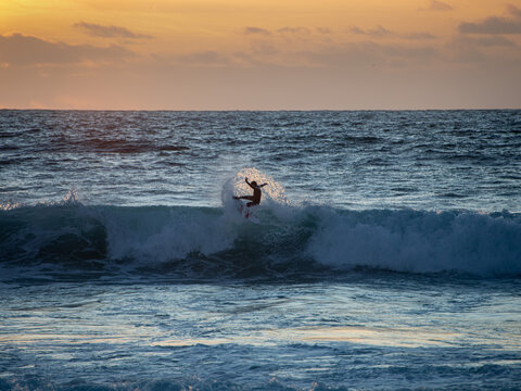 lone sunset surfer