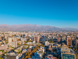 Fototapeta premium Aerial view of Santiago city skyline with Andes mountains in the background, Chile