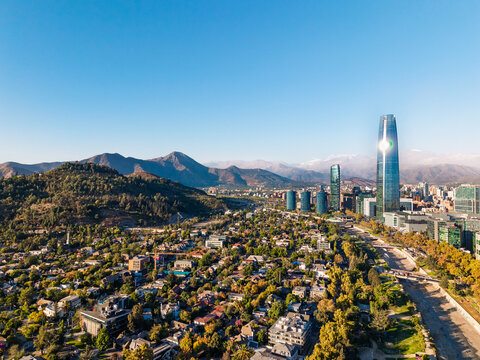 Aerial view of Santiago city skyline with skyscraper and Andes mountains in the background, Chile
