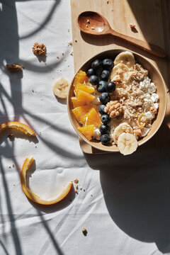 Oatmeal cereal, fruit, and berries for healthy breakfast