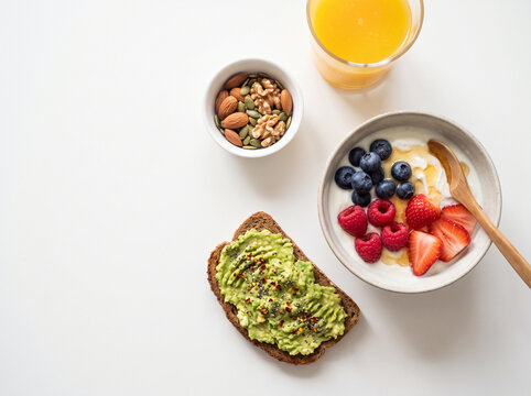 Healthy Breakfast Flat Lay with Yogurt, Berries, and Avocado Toast