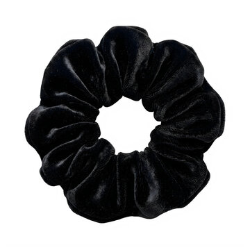 A single black velvet hair scrunchie isolated on transparent background
