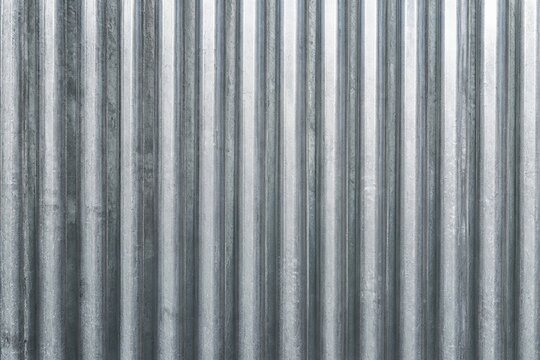 Corrugated metal sheet with vertical ridges texture
