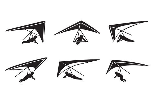 Black silhouette icons of people hang gliding in the air
