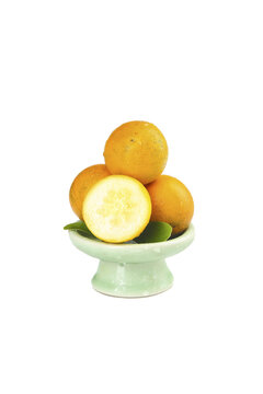 Fresh Passion Fruit in Ceramic Bowl Cut Half Showing Seeds Tropical Fruit White Background