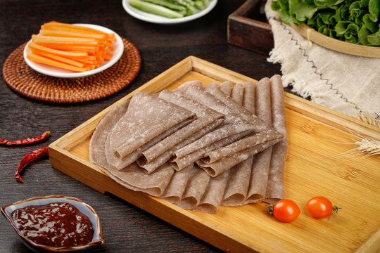 Whole Wheat Pancakes and Rye Rolls with Fresh Vegetables on Wooden Board - Healthy Breakfast Essentials