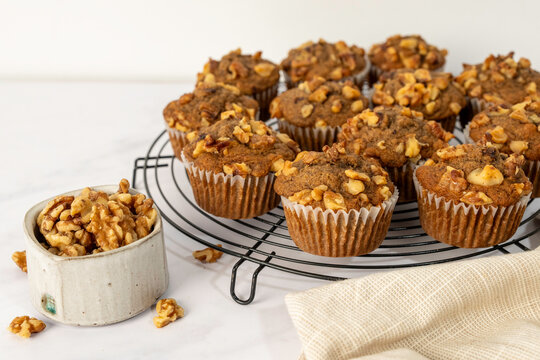 Banana muffins in liners with a metal cooling rack