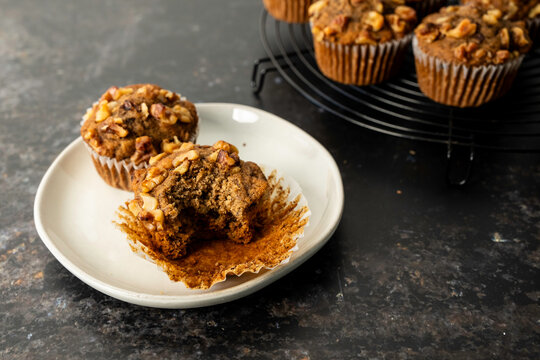 Banana muffins in liners with a metal cooling rack