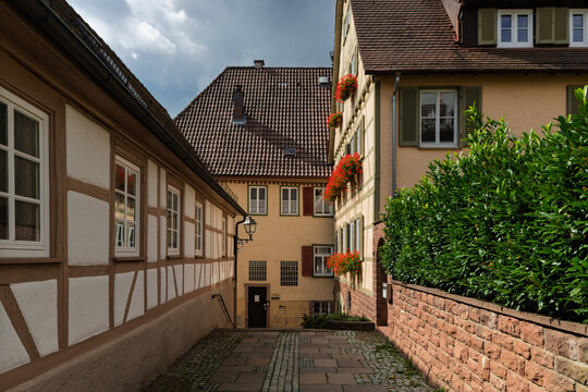 Quiet historic lane lined with traditional half-timbered buildings in Weil der Stadt, Baden-W&uuml;rttemberg, Germany.