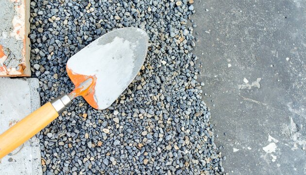 Shovel on a pile of gravel at a construction site