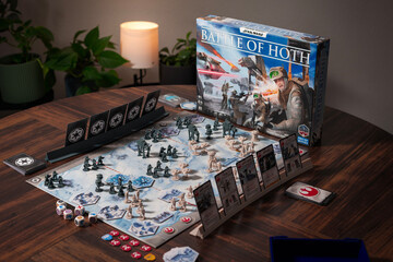 Fototapeta premium Portrait product photography of Star Wars Battle of Hoth board game with components and box displayed with dramatic lighting