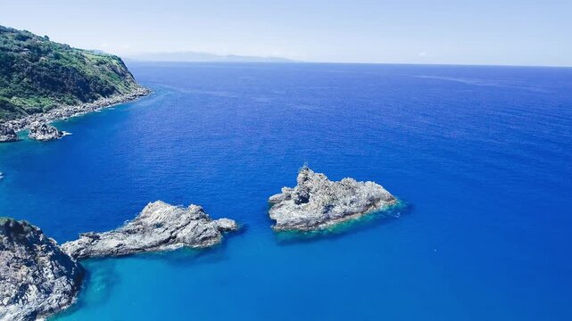 Ulivarella Beach and Ulivo Rock aerial view in slow motion, Calabria, Italy