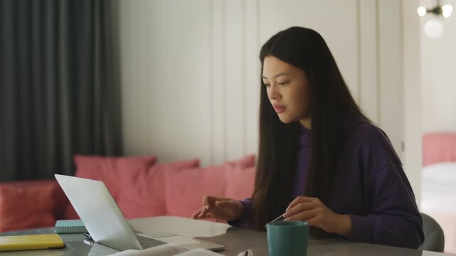 Young Korean woman having credit card payment problems due to maxed-out limit