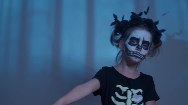 A young girl twirls in a mysterious forest, her face painted like a skeleton. Dark bats flutter around, adding to the eerie Halloween magic as she celebrates.