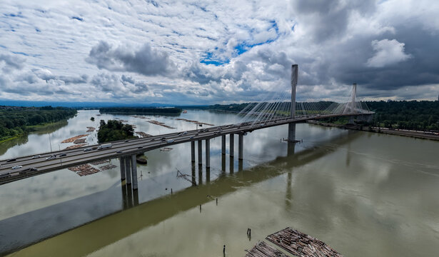 Cable-Stayed Bridge Over Fraser River With Highway Traffic and Log Booms Near Coquitlam Vancouver British Columbia