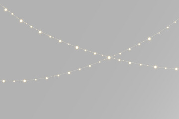 String lights garland with small glowing bulbs arranged in a graceful wave for festive party decoration © theladydarina