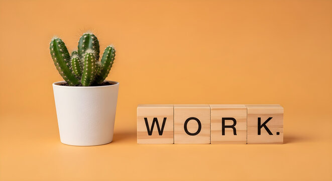 Wooden Blocks Spelling Work Beside a Potted Cactus Plant on a Warm Orange Background Representing Professional Productivity and Office Life
