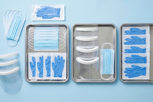 Medical protective equipment organized for hospital readiness on blue background