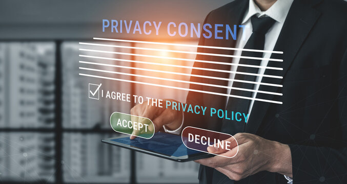 Businessman in Suit Interacting with Digital Privacy Consent Form on Tablet in Modern Office Environment with Urban View Haptic.