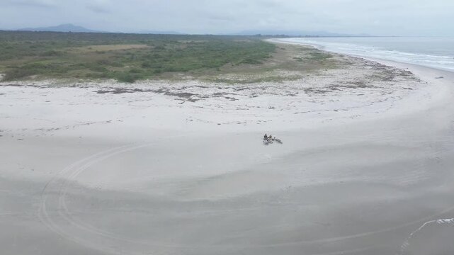 Young couple on a deserted beach. Ilha Comprida, Sao Paulo