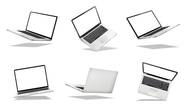 Falling or levitate laptop computers with blank screen isolated on white background with shadow