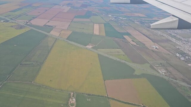 Airplane Descending Over Farmland and Outskirts of Cordoba