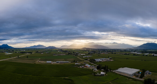 Panoramic Farmland Sunrise Over Mountains and Green Fields in Chilliwack British Columbia Canada