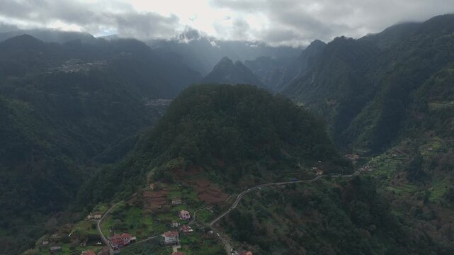 Dramatic mountain valley in S&atilde;o Roque do Faial, Madeira with winding roads and lush forests