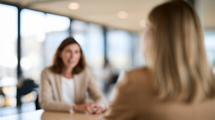 Fototapeta premium Blurred Travel Insurance Consultation with Advisor and International Traveler in Modern Bright Office