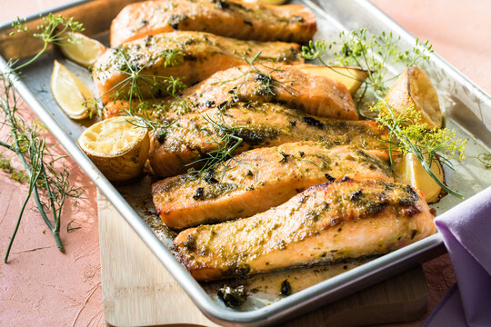 six Roasted salmon steaks with fresh dill, lime.
