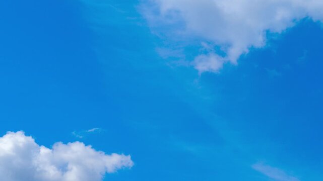 Captivating 4K timelapse captures dynamic motion of clouds swiftly moving across sky. Accelerated time creates mesmerizing. Natural atmospheric background.