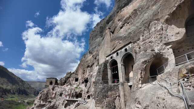 Vardzia cave monastery, a historical complex, carving into Erusheti Mountain in Georgia during the Middle Ages, offering panoramic views of the scenic valley and surrounding landscape