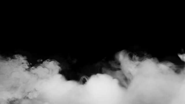Smoke plumes swirl across the bottom of the frame against a deep black backdrop.