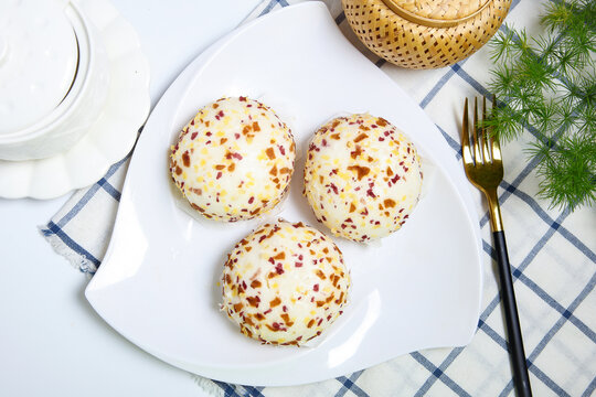 Three colorful crispy crumb coated steamed buns white plate grid tablecloth