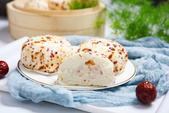 Three colorful crispy crumb coated steamed buns white plate grid tablecloth