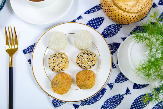 Assorted glutinous rice mochi coconut sesame coated square ceramic plate