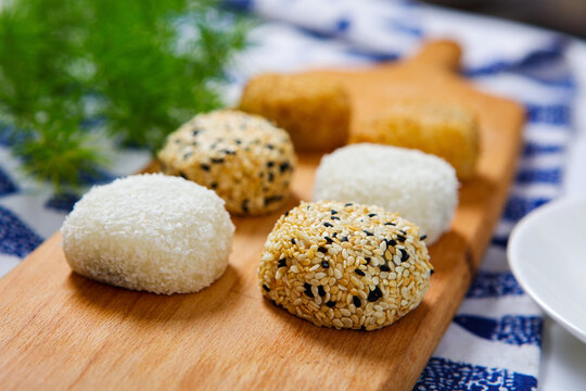 Assorted glutinous rice mochi coconut sesame coated square ceramic plate